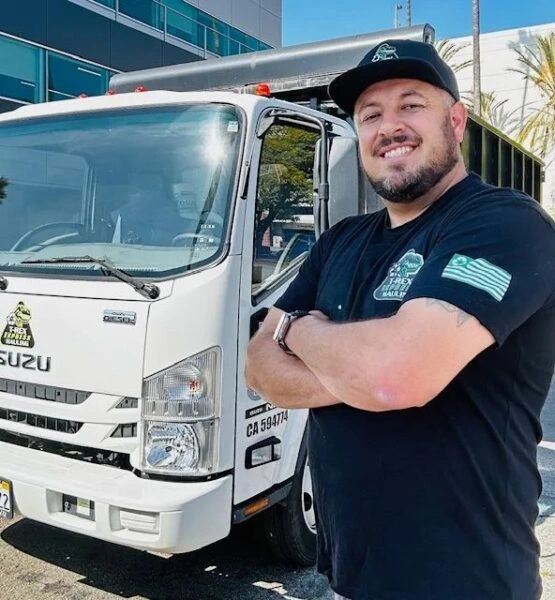 Smiling worker by truck